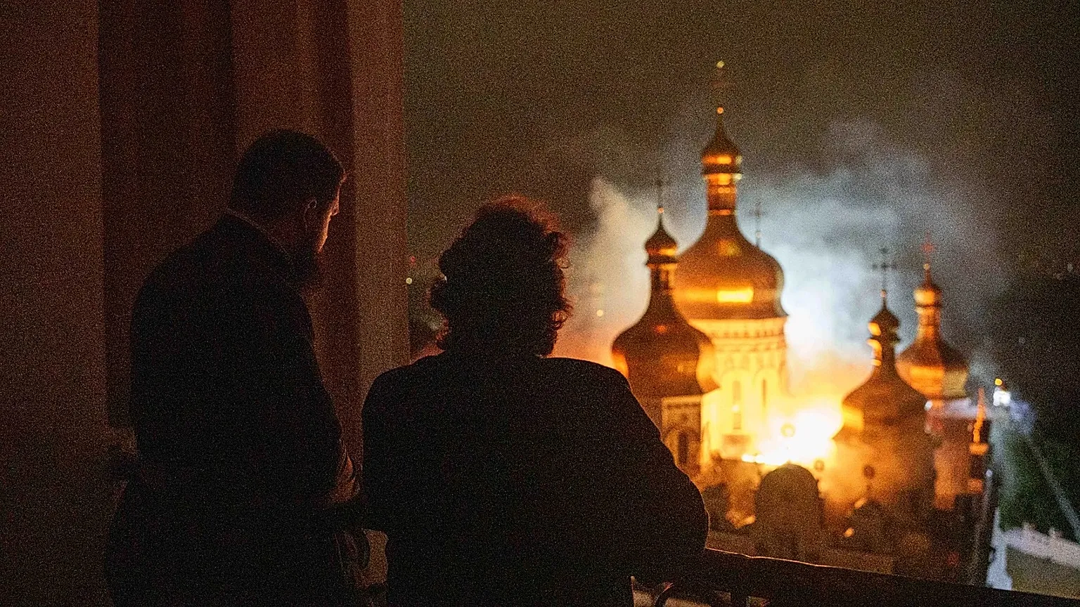 Bishop Avraamiy of the Kyiv-Pechersk Lavra looks at the burning Dormition Cathedral also known as the Monastery of the Caves, during a Russian strike on Kyiv, Ukraine, June 15