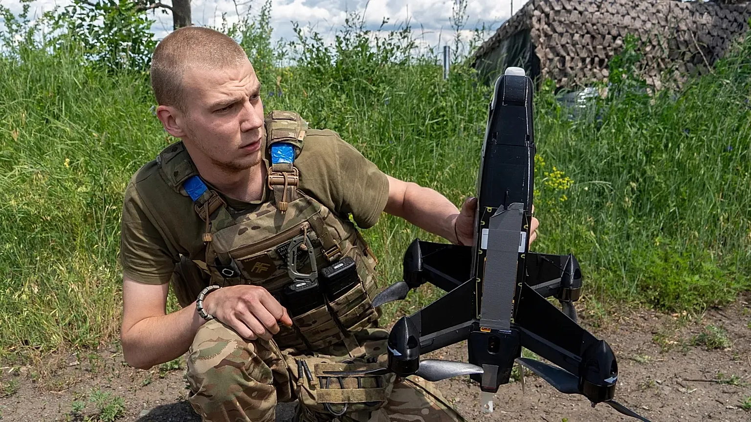 A Ukrainian serviceman of Khartia brigade launches an interceptor drone in Kharkiv region, Ukraine, Friday, June 26, 2026.