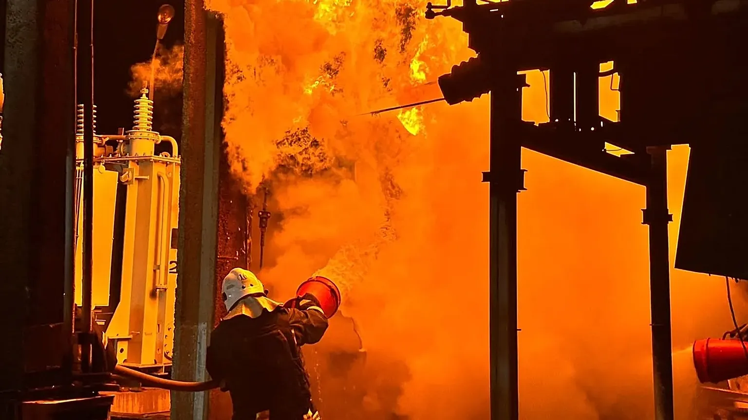 Rescue workers extinguish a fire of an energy facility after a Russian strike in Odesa, 8 June, 2026