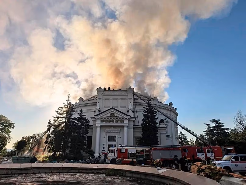 FILE:In this photo provided by Russian occupation authorities firefighters put out a blaze after a Ukrainian drone hit a building in Sevastopol, Crimea, Ukraine, June 10, 2026