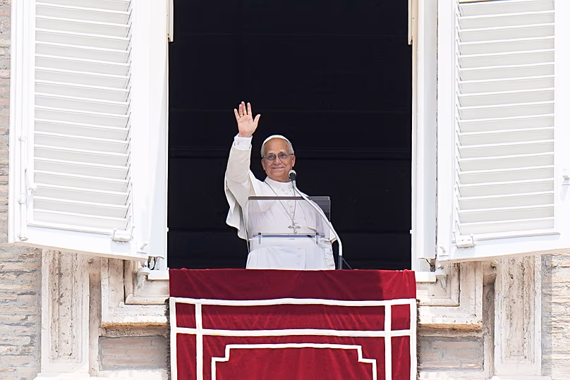 Pope Leo XIV waves during the Angelus noon prayer from the window of his studio overlooking St.Peter's Square at the Vatican, 29 June, 2026