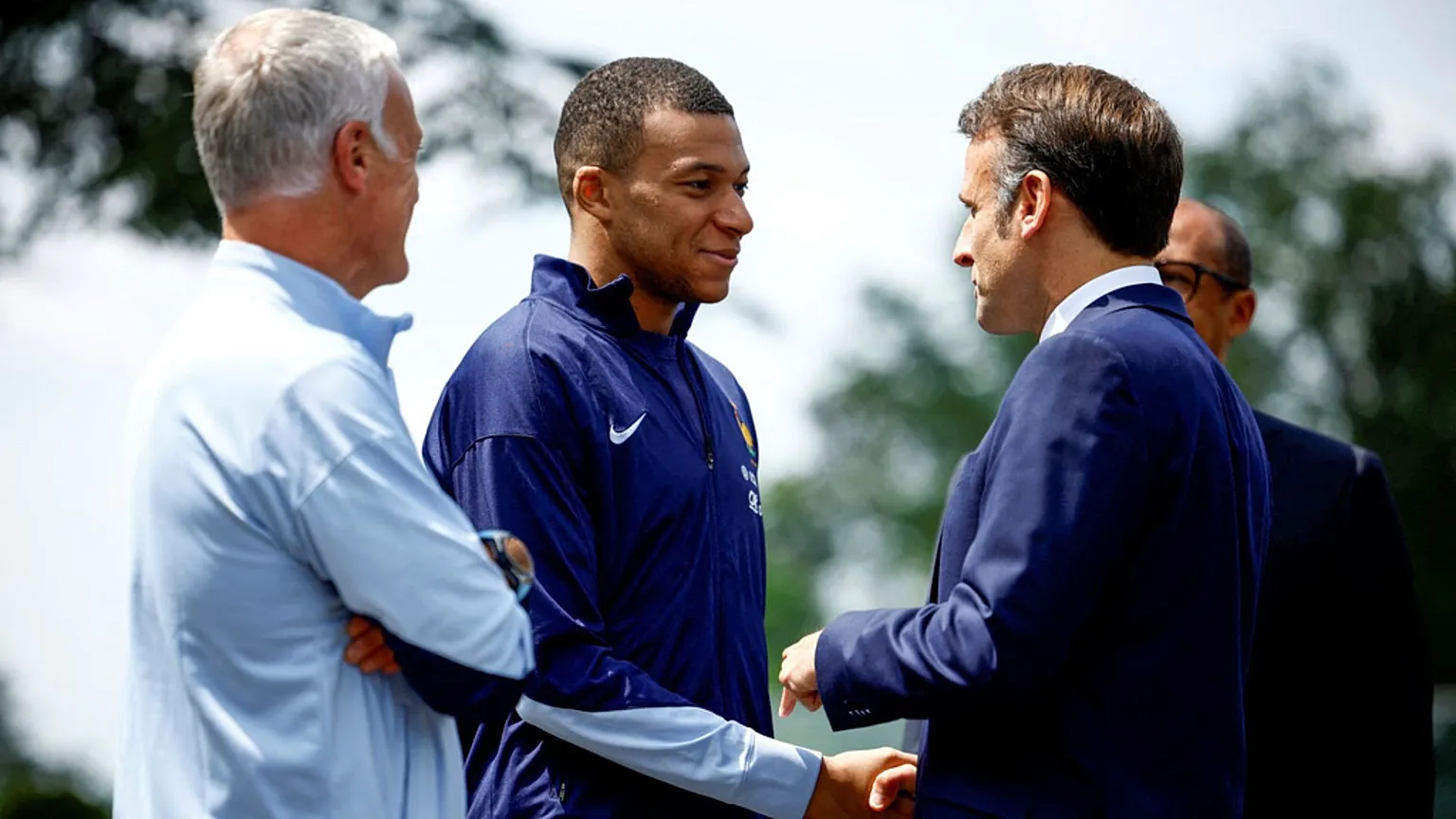 FILE - French President Emmanuel Macron meets Kylian Mbappé and manager Didier Deschamps in Clairefontaine, 3 June 2024