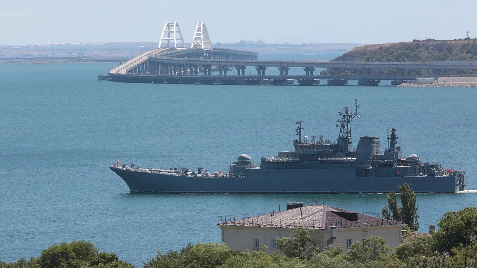 FILE - A Russian military ship transports cars and people from the Russian mainland to the Crimean Peninsula over the Kerch Strait on Monday, July 17, 2023