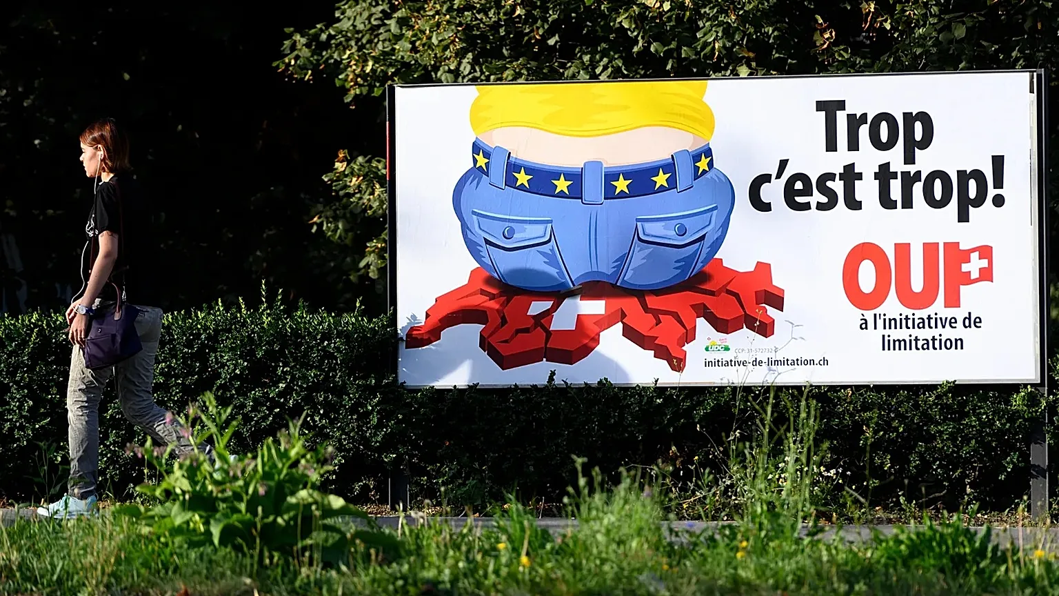 A poster of the Swiss People's Party (SVP) for a moderate immigration initiative reading ''Enough is enough!'' in Lausanne, 27 August, 2020