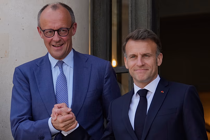 France's President Emmanuel Macron welcomes German Chancellor Friedrich Merz prior to an international summit in Paris, 17 April, 2026