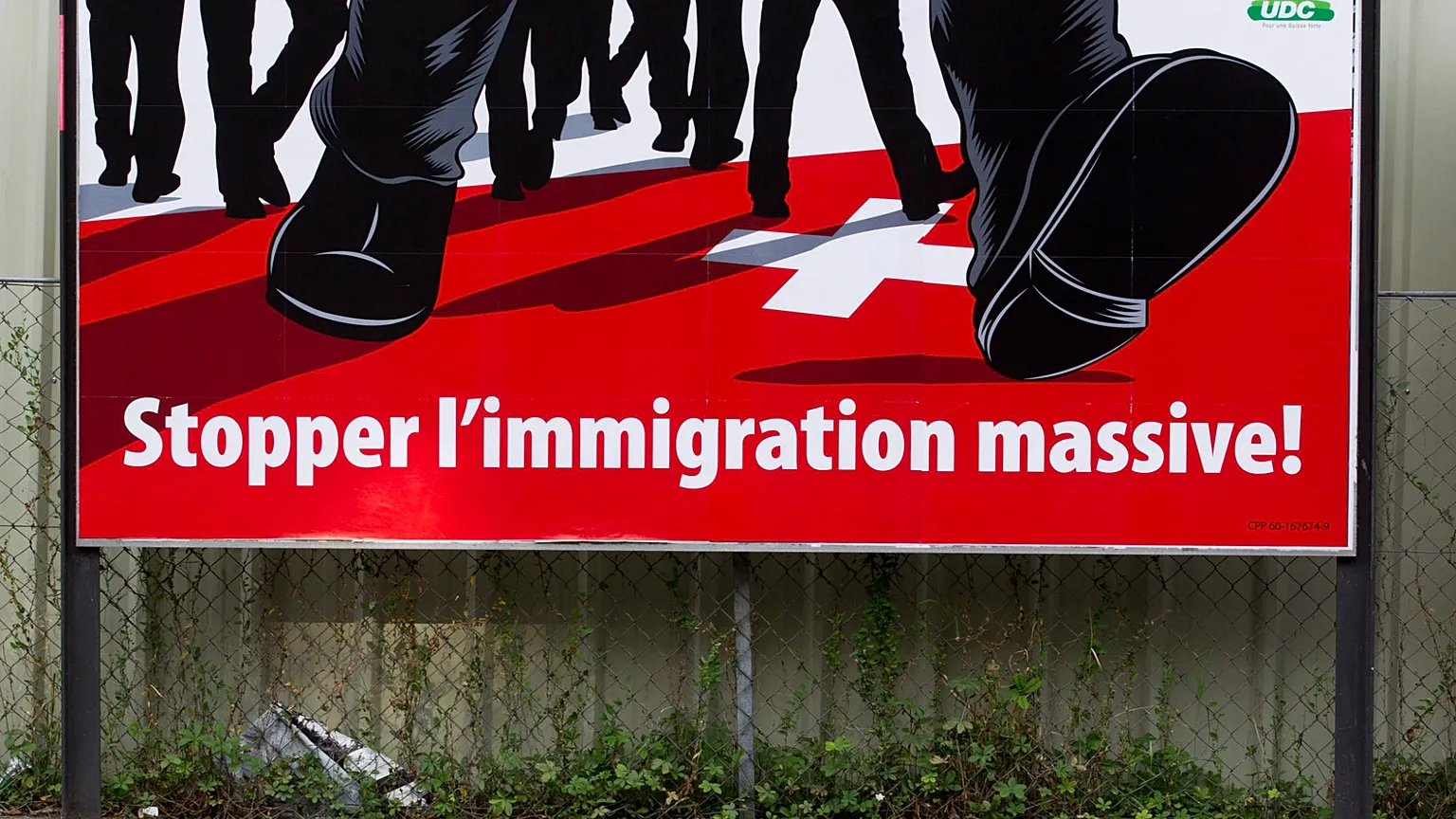 FILE - This Aug. 2, 2011 file photo shows a poster of the rightwing Swiss People's Party (SVP) with the message "Stop mass immigration."