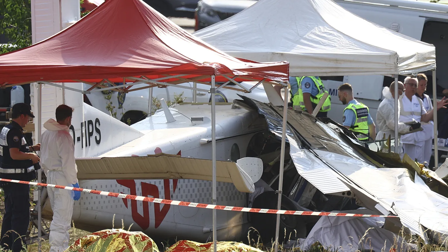 Forensic police technicians examine a skydiving plane that crashed in Tomblaine, killing all 11 people on board, on Sunday 28 June 2026.