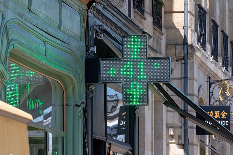 A drugstore sign shows the temperature of 41 degrees Celsius (105,8 degrees Fahrenheit) in Bordeaux, southwestern France, on 23 June 2026