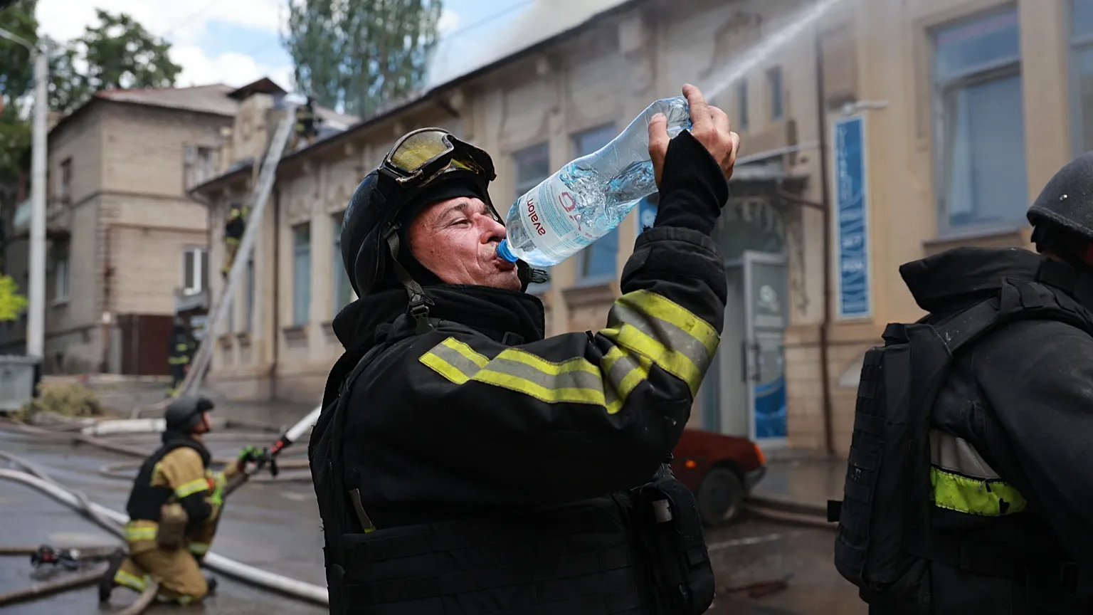 Rescue workers put out a fire at a building destroyed after a Russian strike on Zaporizhzhia, 26 June, 2026