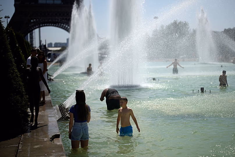 People cooling off in the fountains in the Trocadéro gardens in Paris, archive images