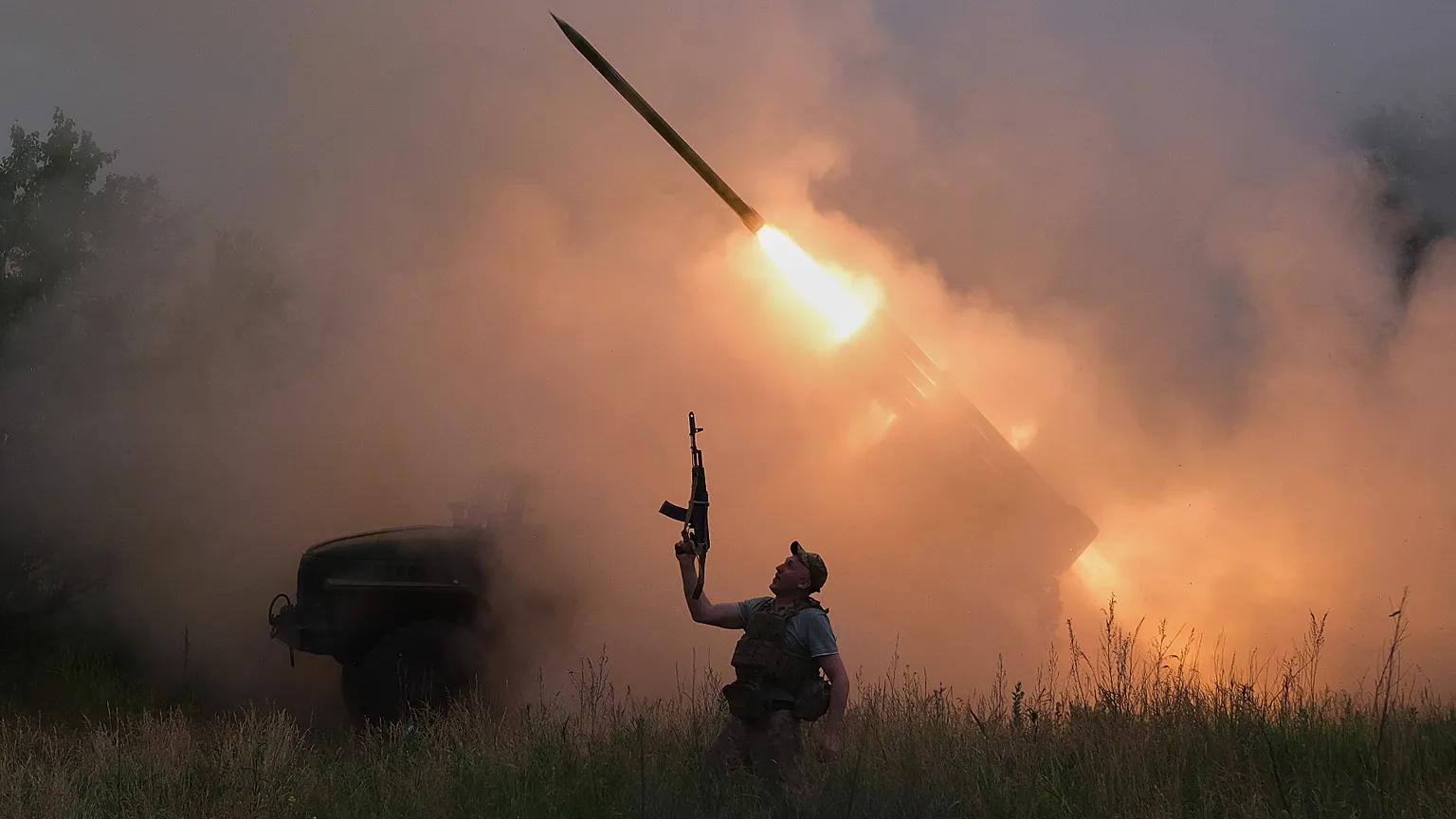 a soldier reacts as an MRLS BM-21 "Grad" fires at the Russian positions near Kostiantynivka, Donetsk region, Ukraine, June 4, 2026.
