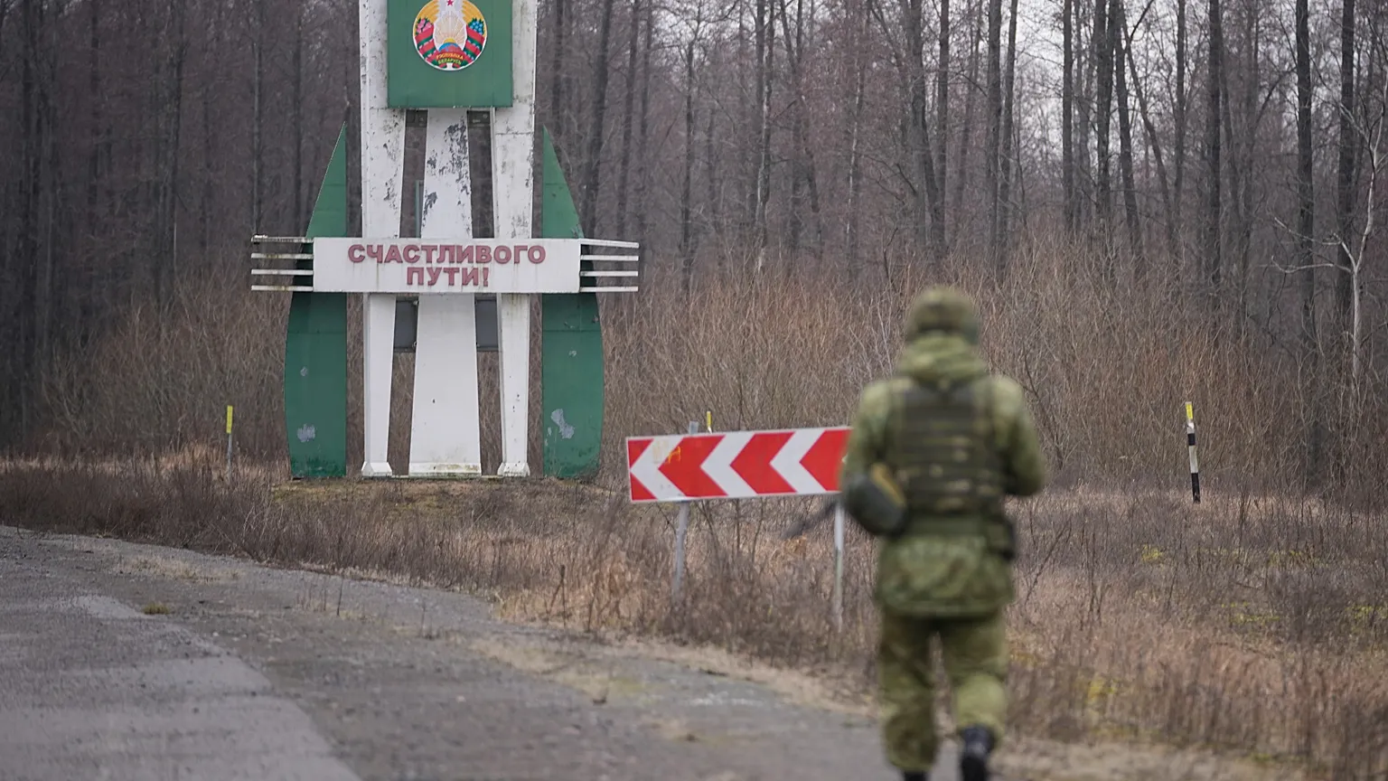 FILE: A Belarusian border guard inspects a road from Belarusian border checkpoint, in Gomel region, Belarus, Tuesday, Jan. 28, 2025.