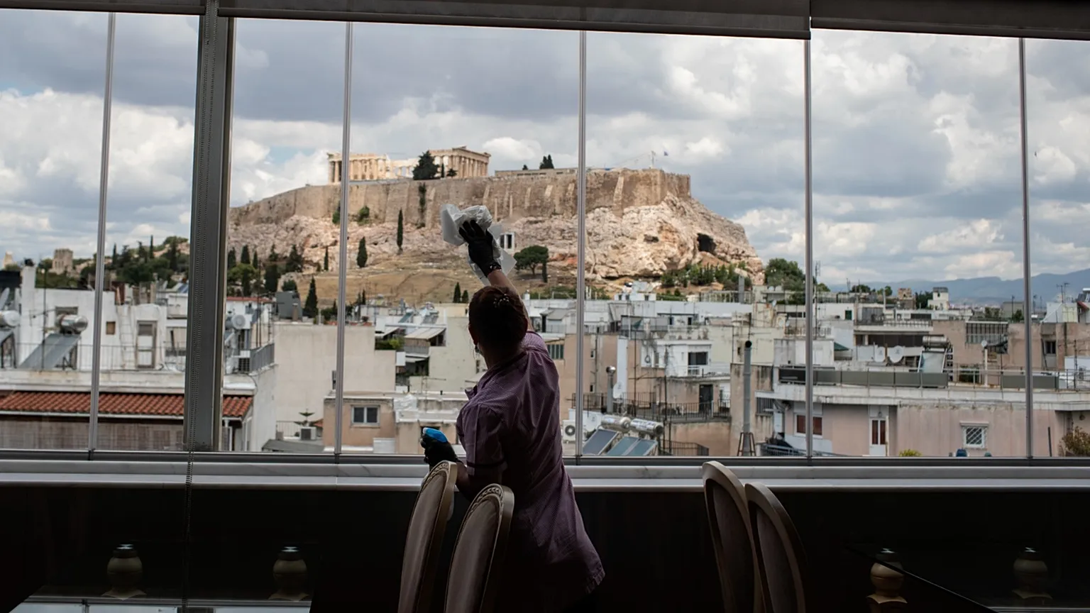 Worker cleans windows