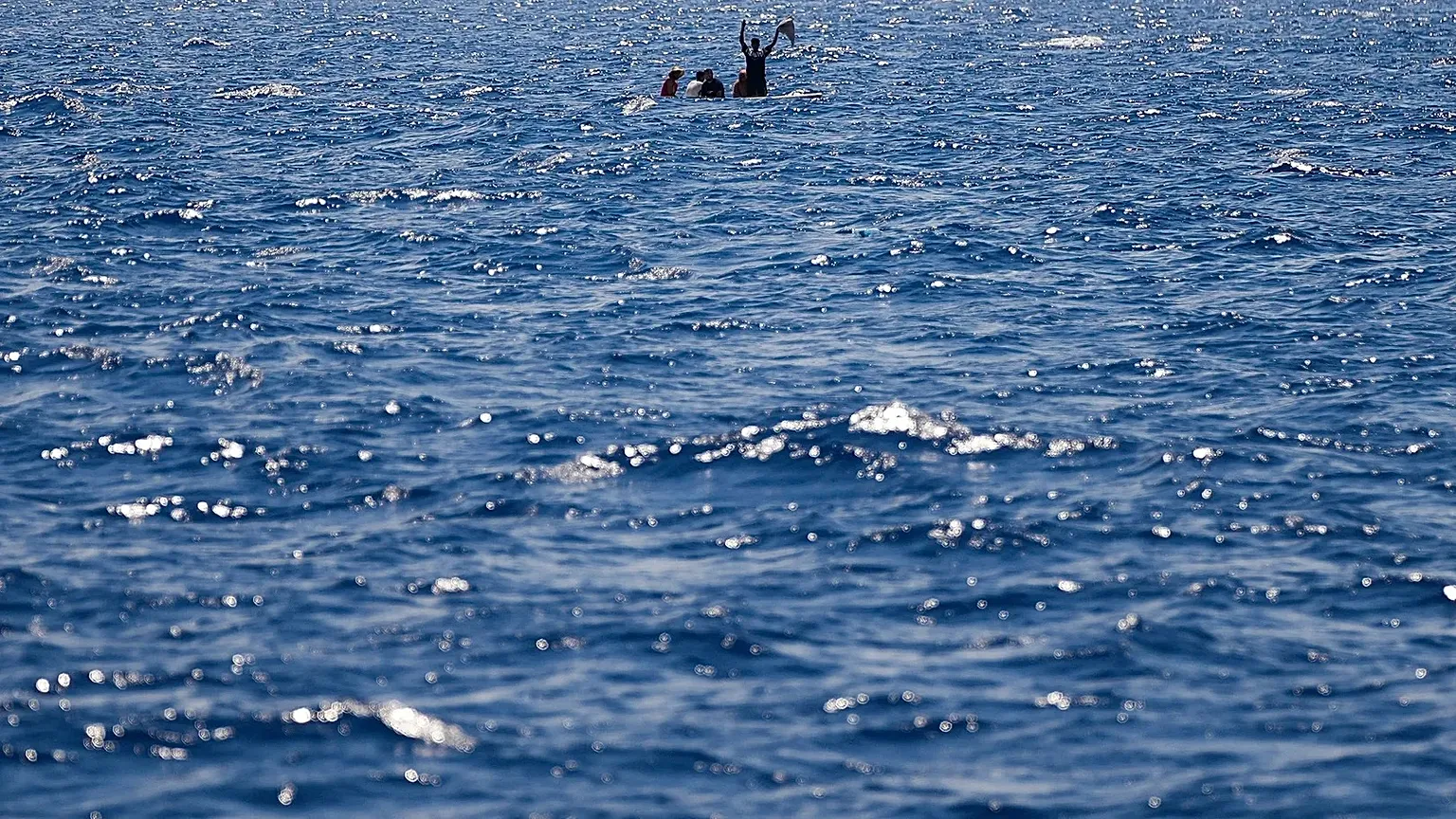 Migrants from Syria and Libya call for help as they are assisted by Spanish NGO Open Arms in the Mediterranean Sea, 10 August, 2022