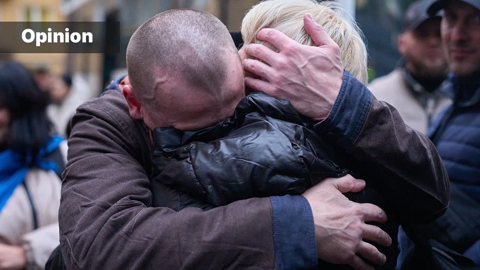 A soldier returning from Russian captivity hugs his wife during a POW exchange between Russia and Ukraine in Chernyhiv region, Ukraine, Thursday, Oct. 2, 2025