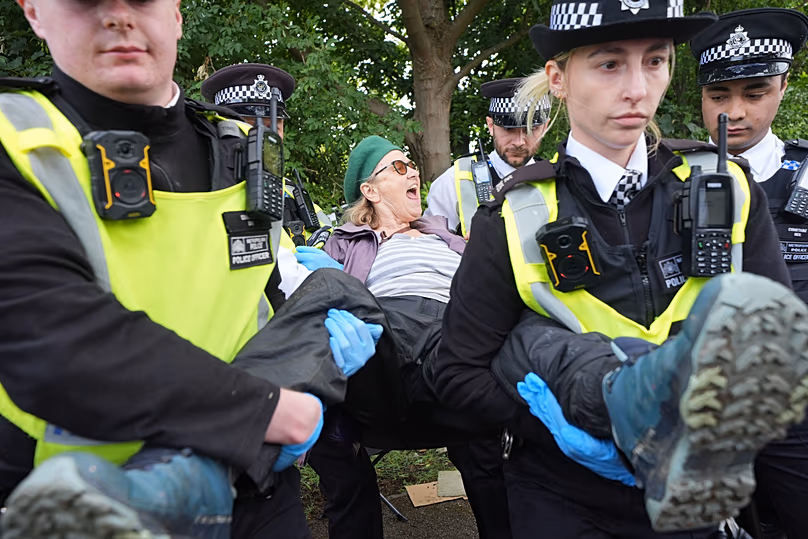 Protesters are detained by police outside Woolwich Crown Court, London, during a hearing where Palestine Action activists are sentenced, June 12, 2026.