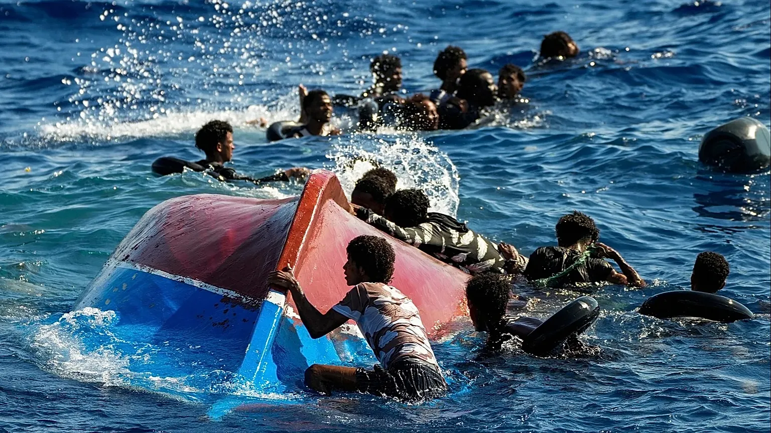 Migrants from Syria and Libya in a wooden boat call for help in the Mediterranean Sea, 11 August, 2022