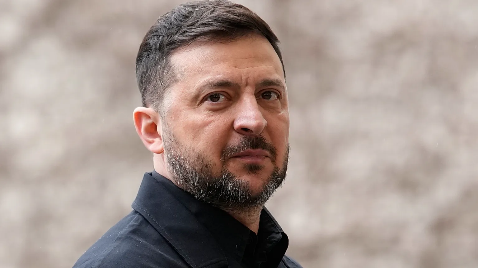 Ukraine's President Volodymyr Zelenskyy attends a welcome ceremony ahead of German-Ukrainian government consultations in Berlin Germany, Tuesday, April 14, 2026. 