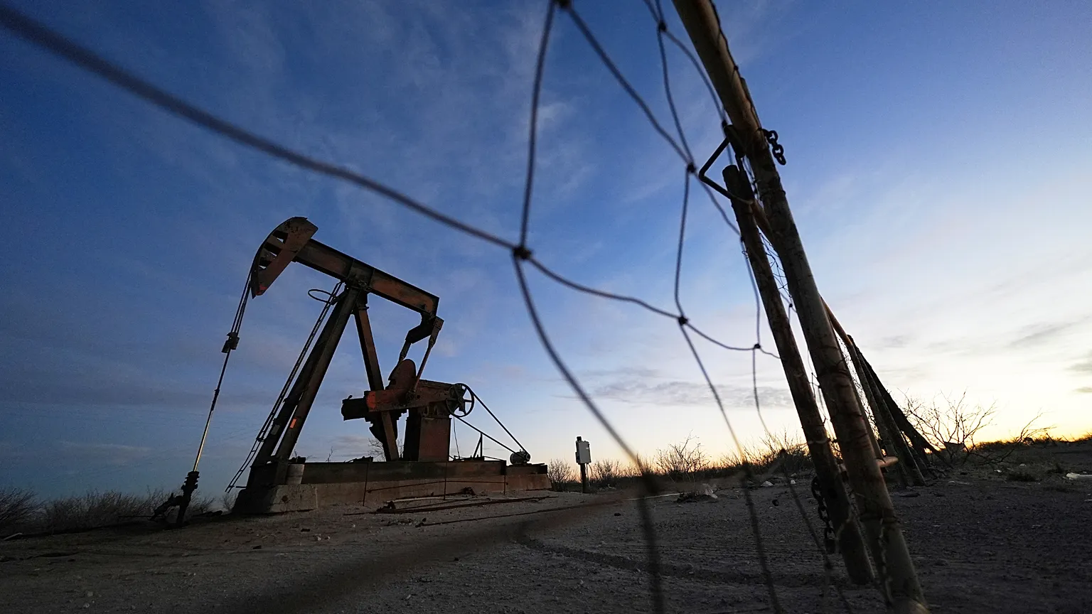 A pumpjack is visible before sunrise Feb. 26, 2025, in Kermit, Texas.