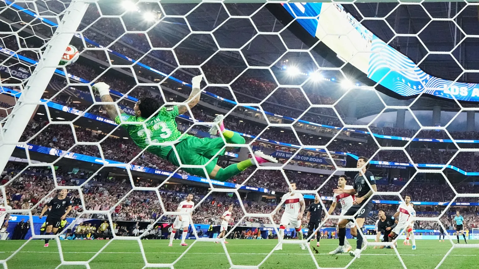 Turkey goalkeeper Ugurcan Cakir makes a diving save during the World Cup Group D soccer match between Turkey and the United States, 25 June 2026,