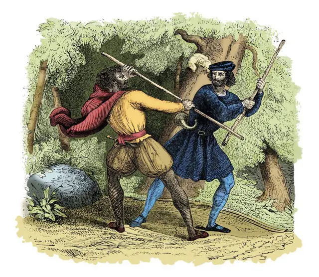 Imagen que muestra a dos hombres luchando armados con dos varas de madera en un bosque.