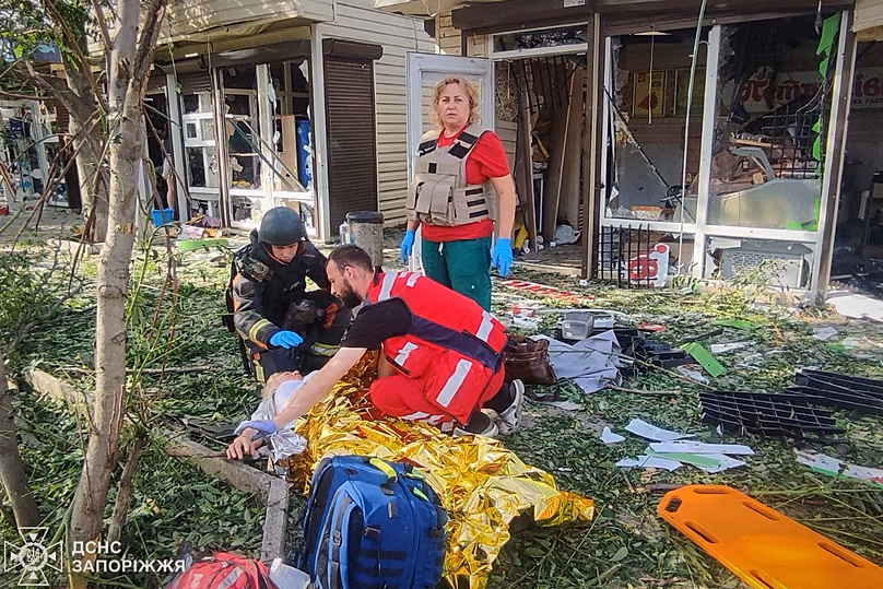 Paramedics provide medical help to an injured person after a Russian strike in Zaporizhzhia, 8 June, 2026