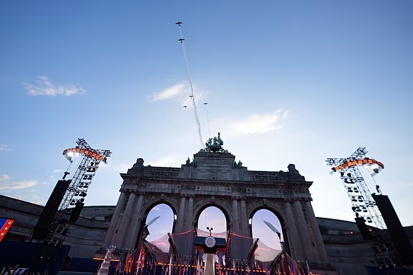 Planes perform a flyover the Cinquantenaire Arch during the America 250 event in Brussels, 28 June, 2026