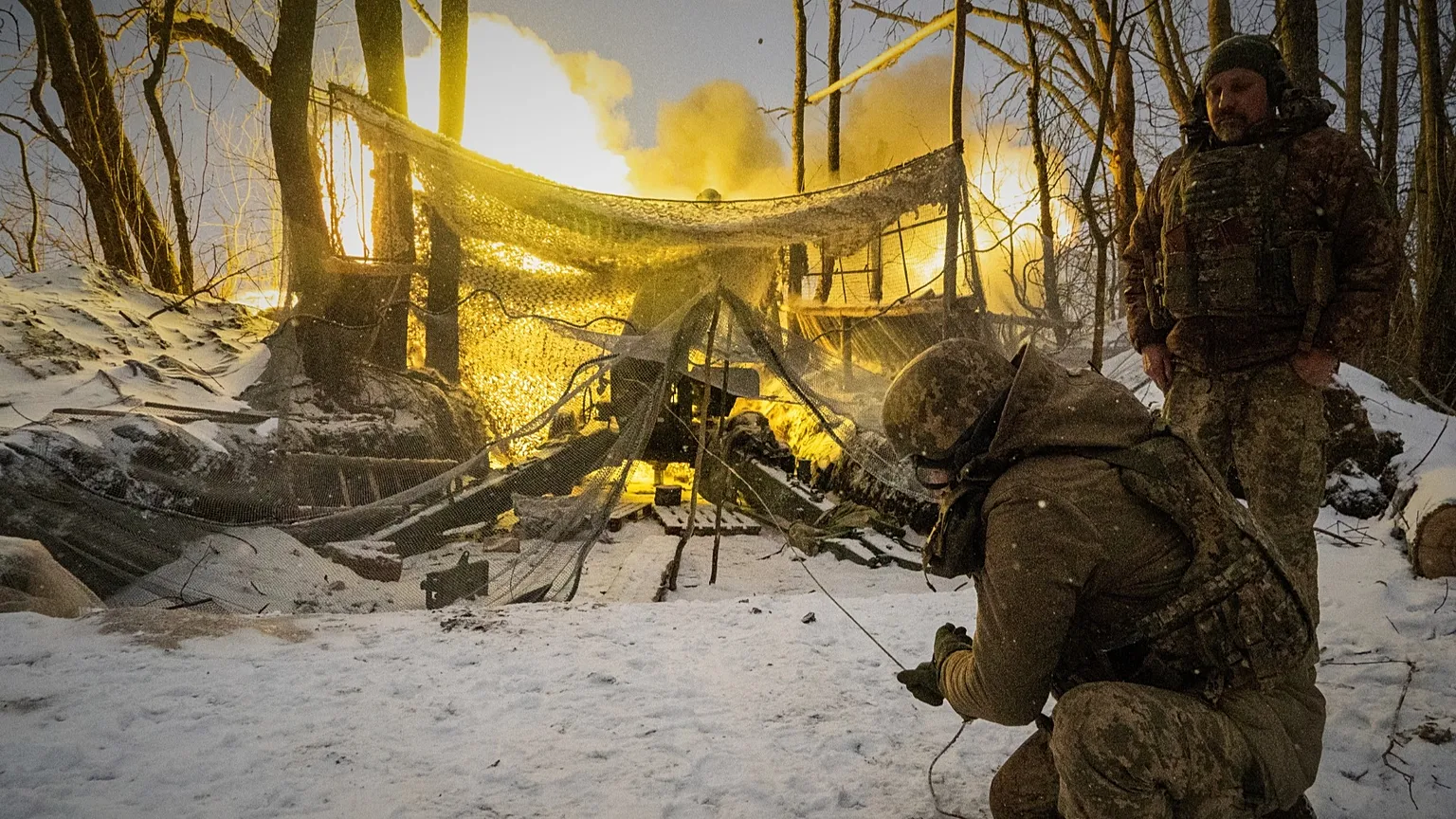 Ukrainian soldiers fire at Russian positions on the front line in the Kharkiv region, 18 February, 2026
