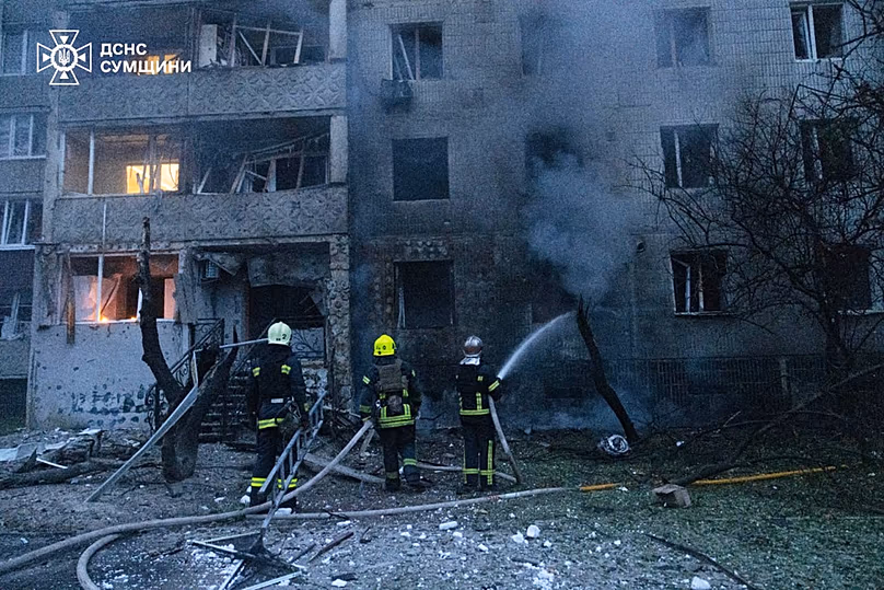 In this photo provided by the Ukrainian Emergency Service, firefighters put out a fire of residential building following a Russian air attack in Sumy, Ukraine, Tuesday, July 2