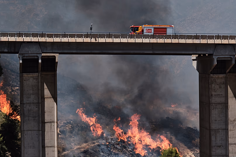 A firefighter truck next to a wildfire in Los Gallardos, near Almeria, Spain, Friday, July 10, 2026.