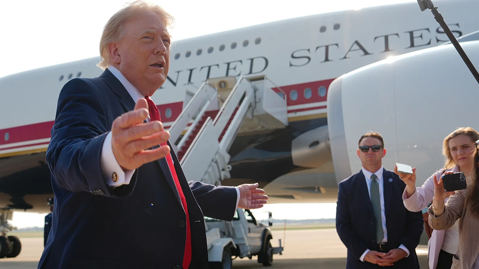 President Donald Trump speaks to reporters before boarding Air Force One, Wednesday, July 1, 2026, at Joint Base Andrews, Md. (AP Photo/Julia Demaree Nikhinson)