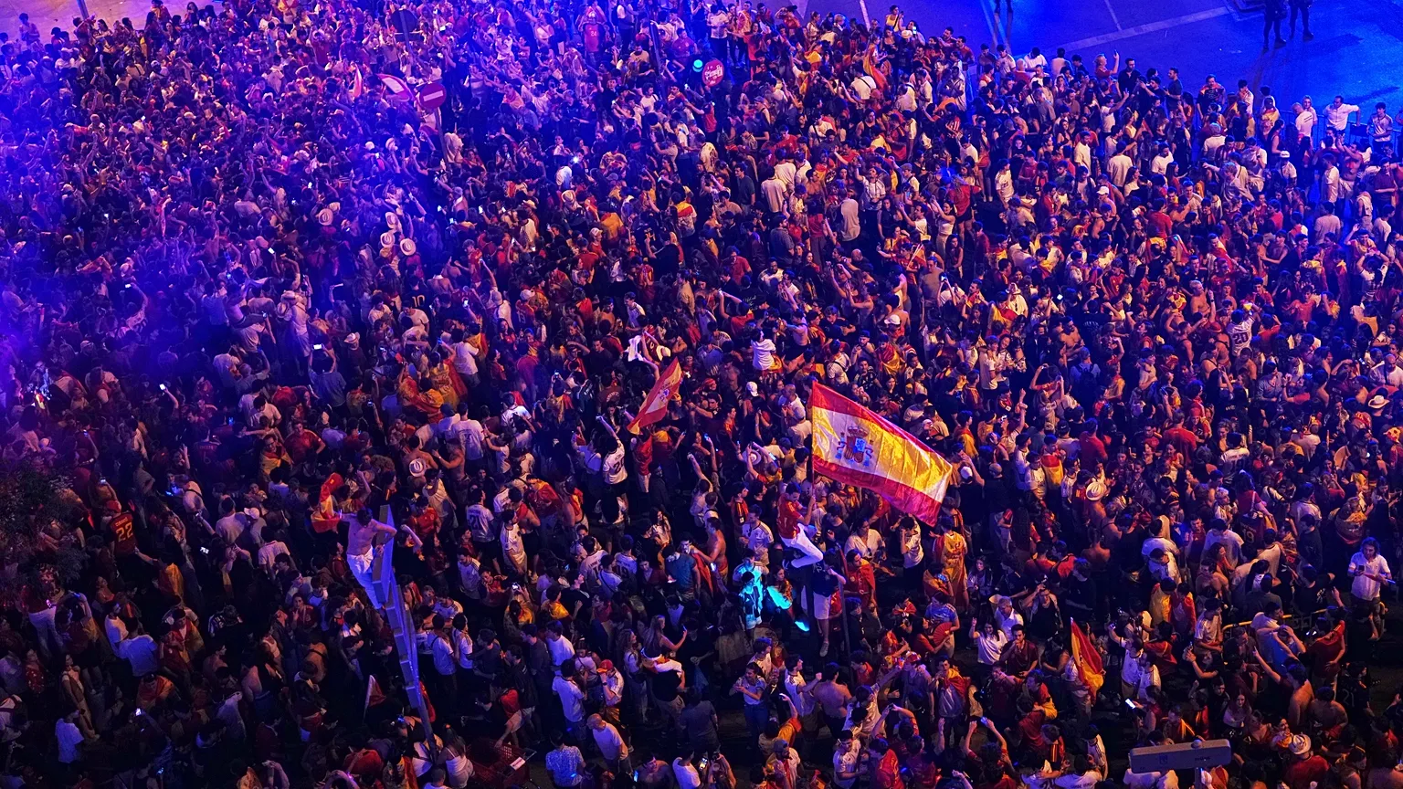 Spanish fans celebrate in Madrid after Spain's victory over Argentina in the World Cup final, held in East Rutherford, New Jersey