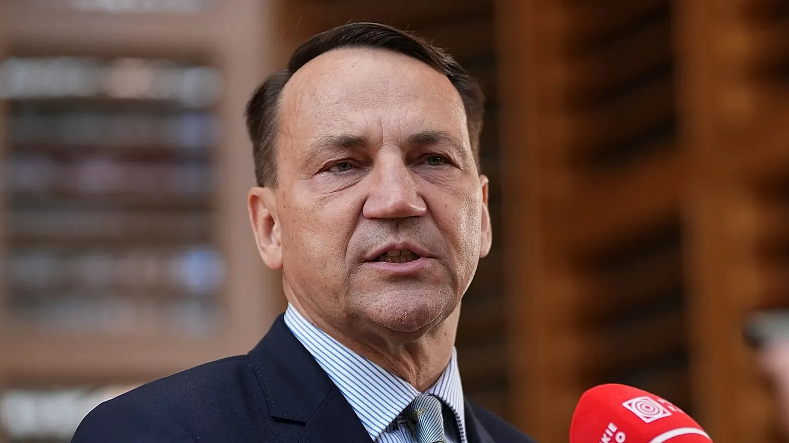 Radosław Sikorski speaks to the media in Brussels on 13 July 2026