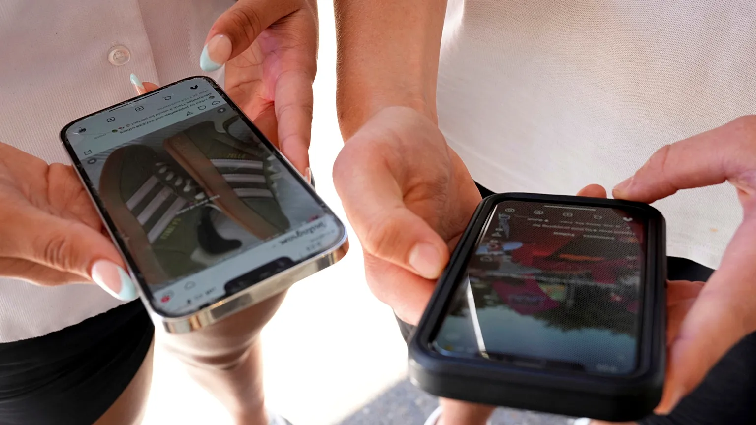 Young persons use their phones to view social media in Sydney, on 8 November 2024.