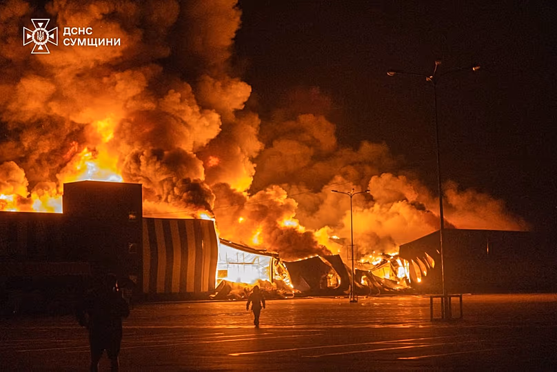 In this photo provided by the Ukrainian Emergency Service, firefighters put out a fire following a Russian air attack in Sumy, Ukraine, Tuesday, July 21, 2026