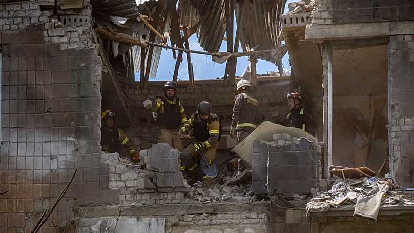 Rescue workers search for victims after a Russian air attack in Kharkiv, 8 July, 2026