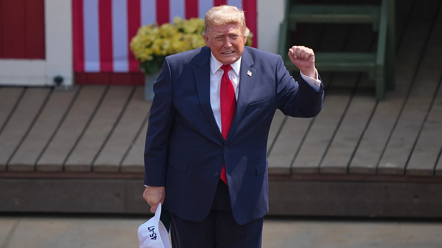 President Donald Trump leaves the stage after speaking at the Burning Hills Amphitheater during the Theodore Roosevelt Presidential Library opening ceremony Wednesday, July 1,