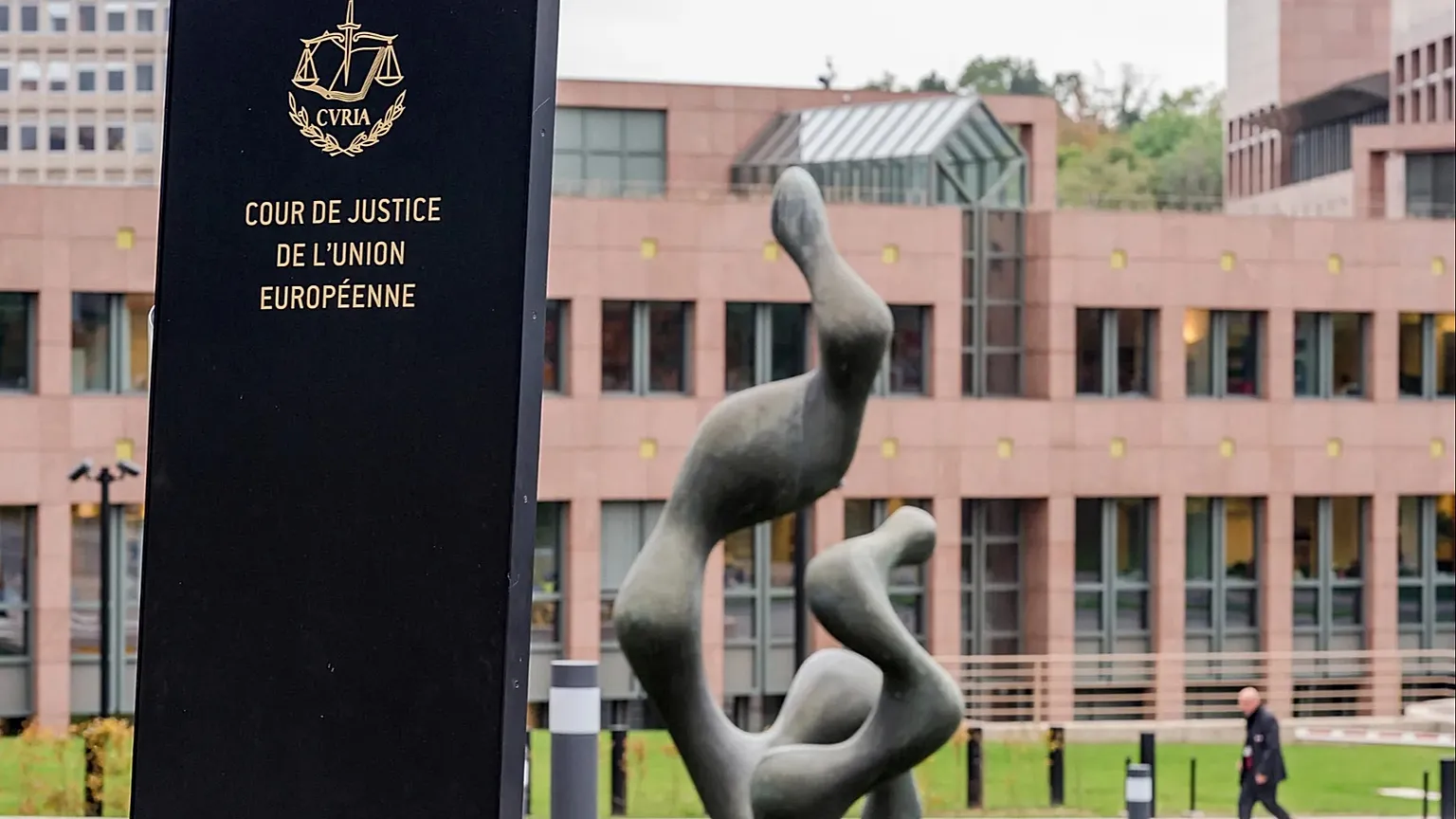 A man walks by the European Court of Justice in Luxembourg, Oct. 5, 2015.