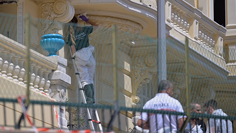 Investigators examine the scene at the residential building where an explosive device seriously injured three people in Monaco, 30 June, 2026