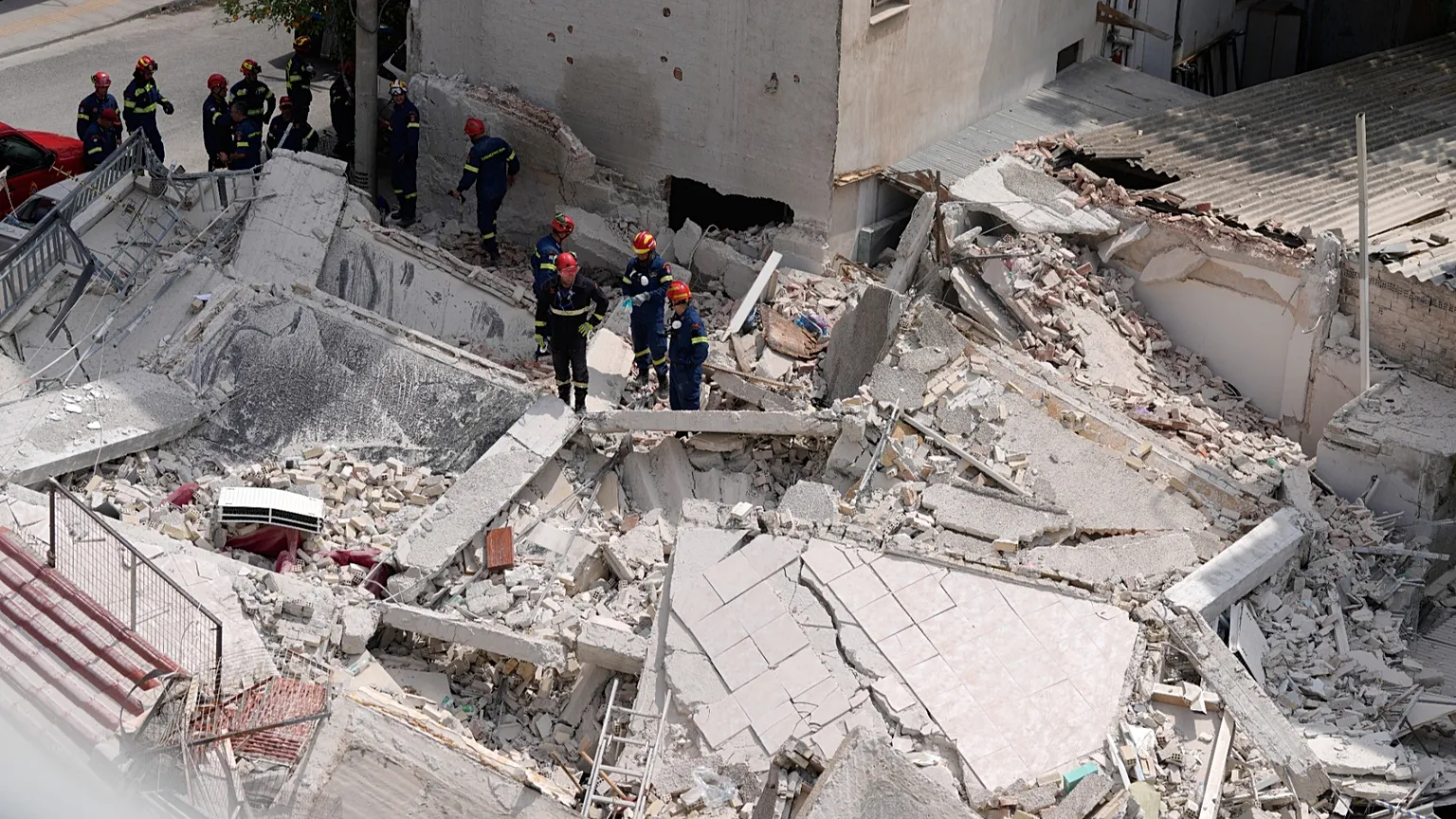 Rescuers search through the rubble of a building that collapsed in the Petralona neighbourhood of central Athens, 30 June, 2026