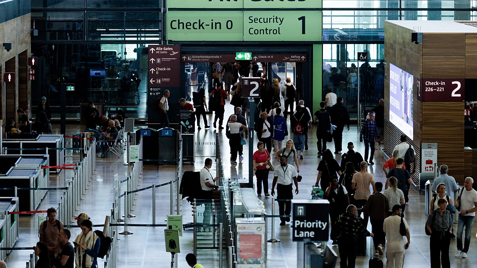 Passengers in a terminal at Berlin's Brandenburg airport, in Schönefeld, Germany, Saturday Sept. 20, 2025, after a cyberattack targeting check-in and boarding systems disrupte