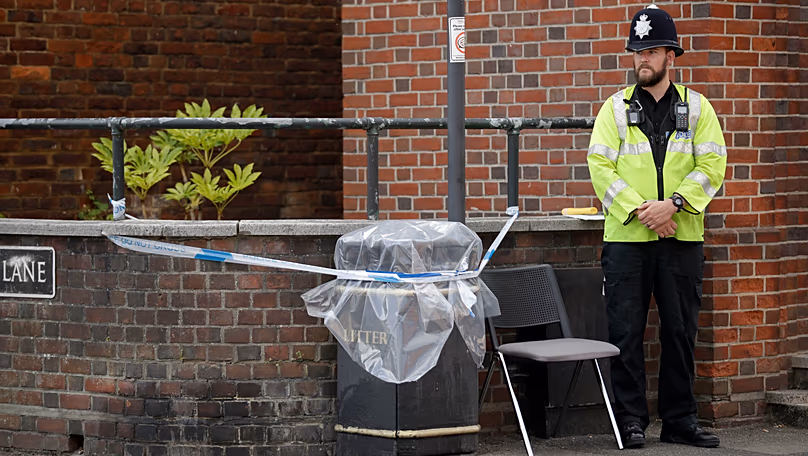 A British police officer guards a cordon around a plastic covered rubbish bin near John Baker House for homeless people in Salisbury, 5 July, 2018