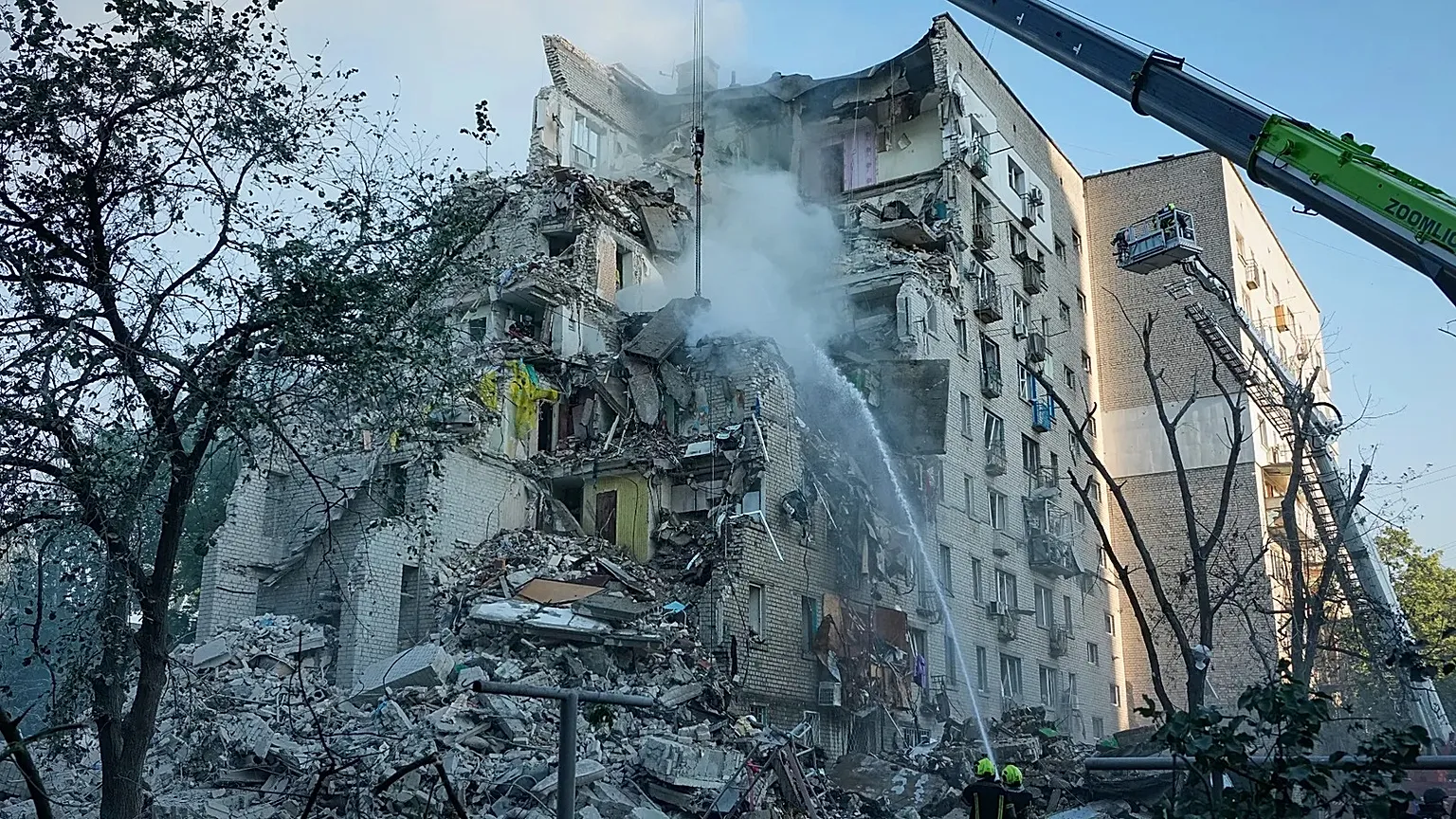 Emergency services personnel work to extinguish a fire after a Russian strike on Kyiv, 2 July 2026.