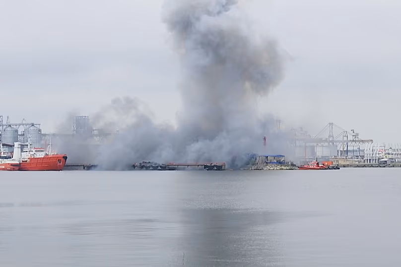 In this photo taken from video provided by OBSERVATOR ANTENA 1, smoke rises after an explosion of sea drone is seen in Constanta port, Romania, Friday, June 5, 2026.