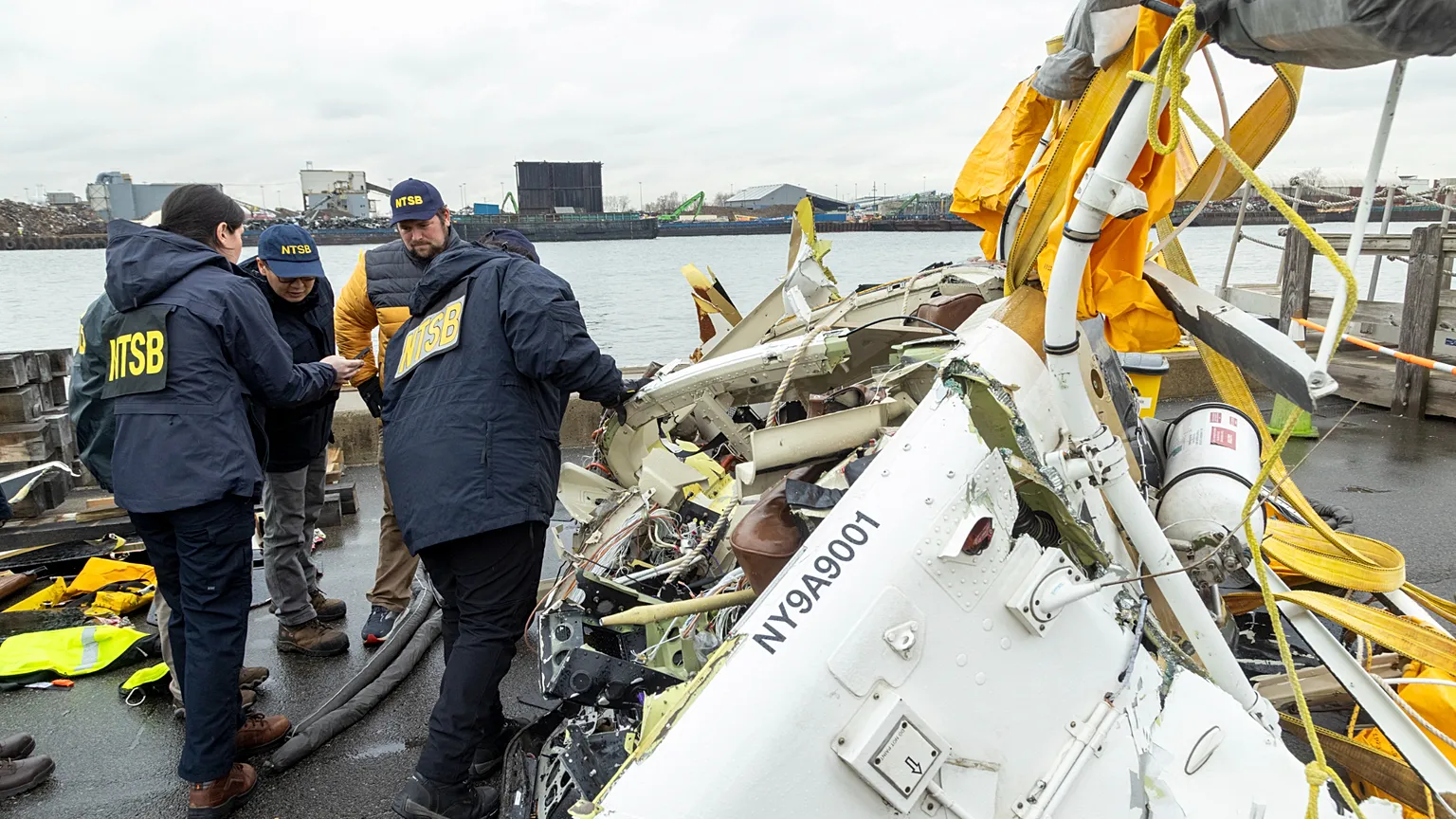 On 11 April 2025 in Jersey City, the US National Transportation Safety Board inspects the wreckage of the Bell 206L-4 helicopter that crashed in the Hudson on 10 April.