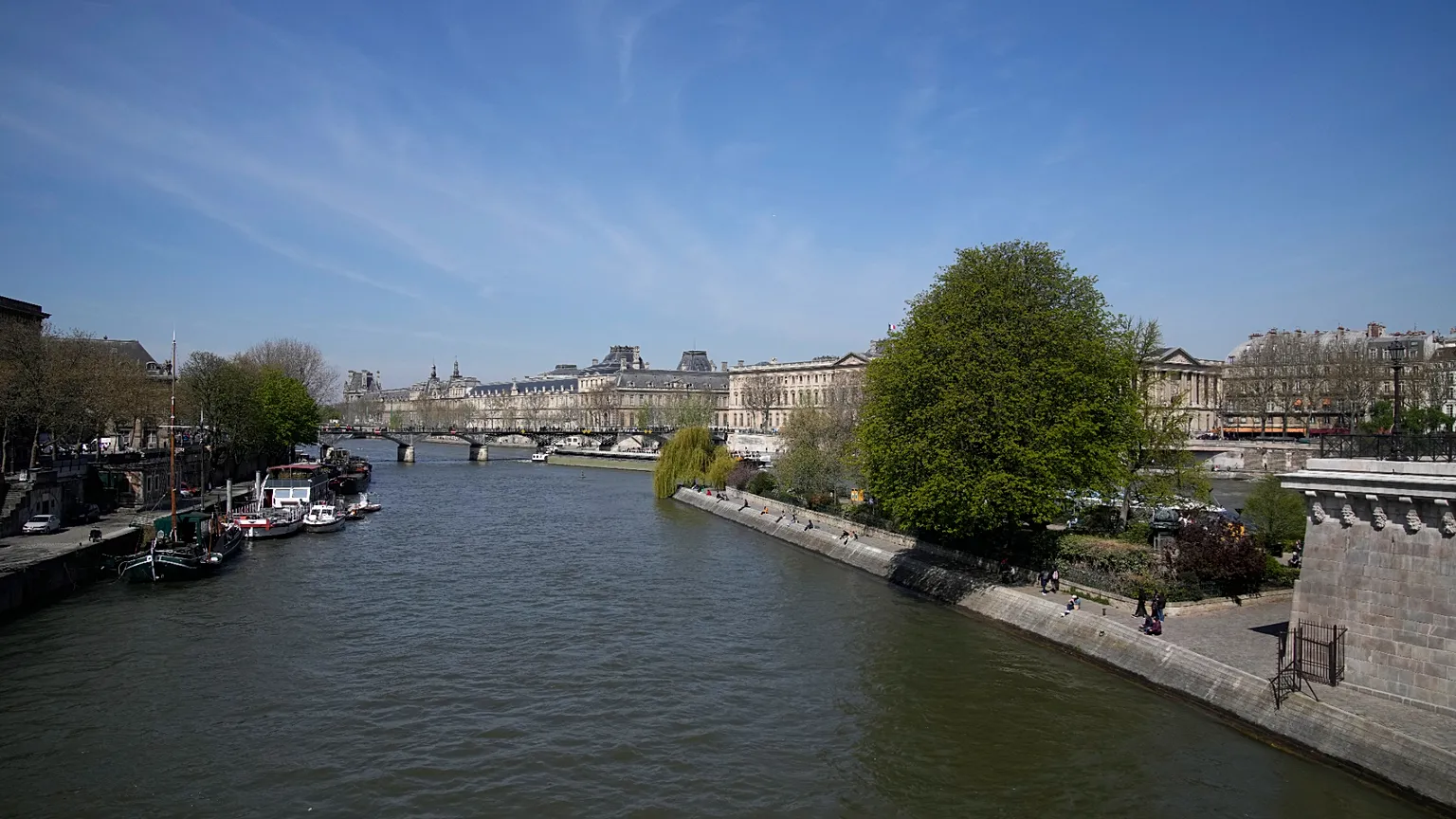 The River Seine flows in Paris, Wednesday, April 5, 2023. A costly and complex clean-up is resuscitating the River Seine just in time for it to play a starring role in the 202