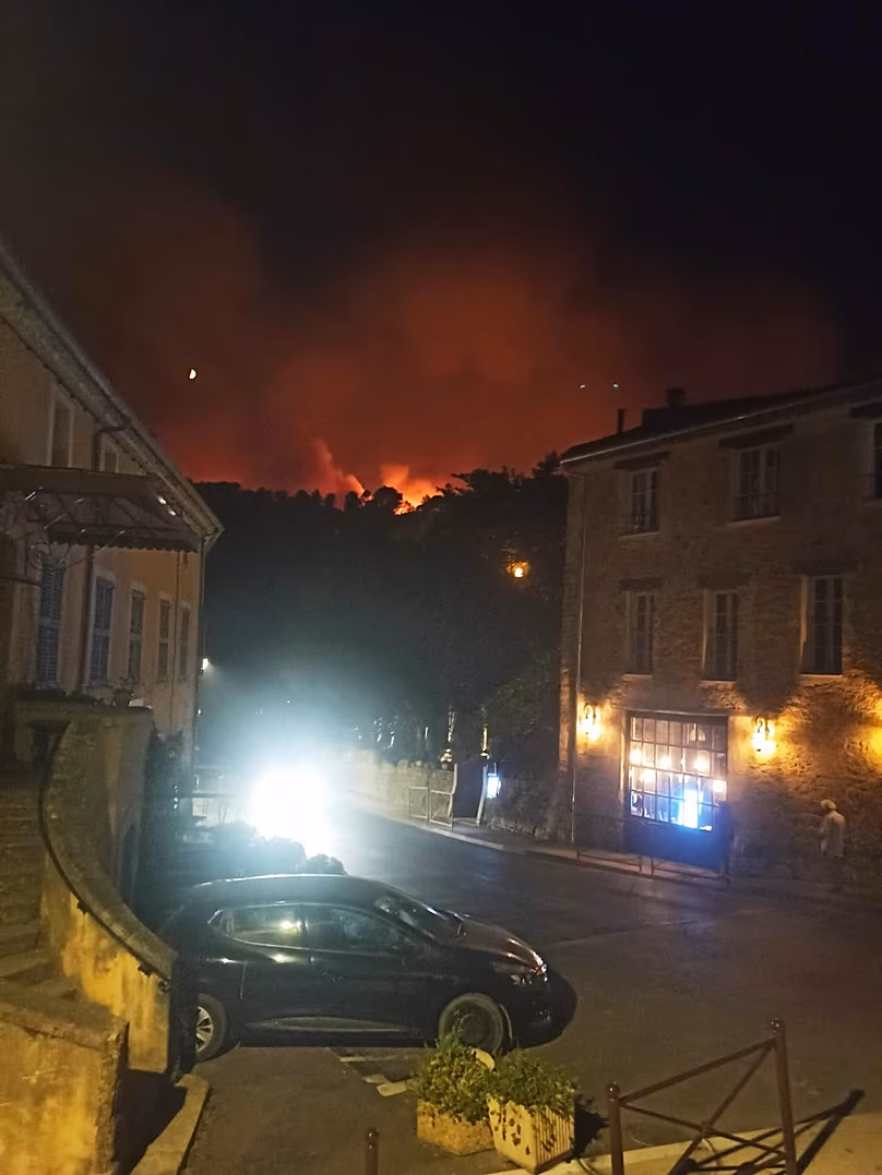 Fire nears the outskirts of the village of Pontignac, in Provence, south of France, 21 July 2026