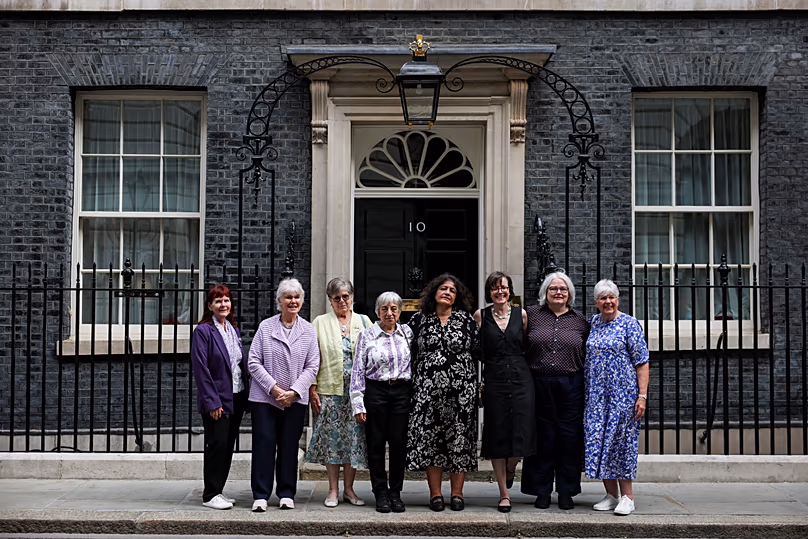 Campaigners pose for a photo after a meeting with British Prime Minister Keir Starmer to discuss historical forced adoption, outside 10 Downing Street in London, July 2, 2026.