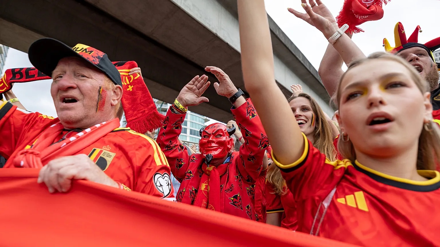 Belgium fans march toward B.C. Place prior to a World Cup Group G soccer match against New Zealand,