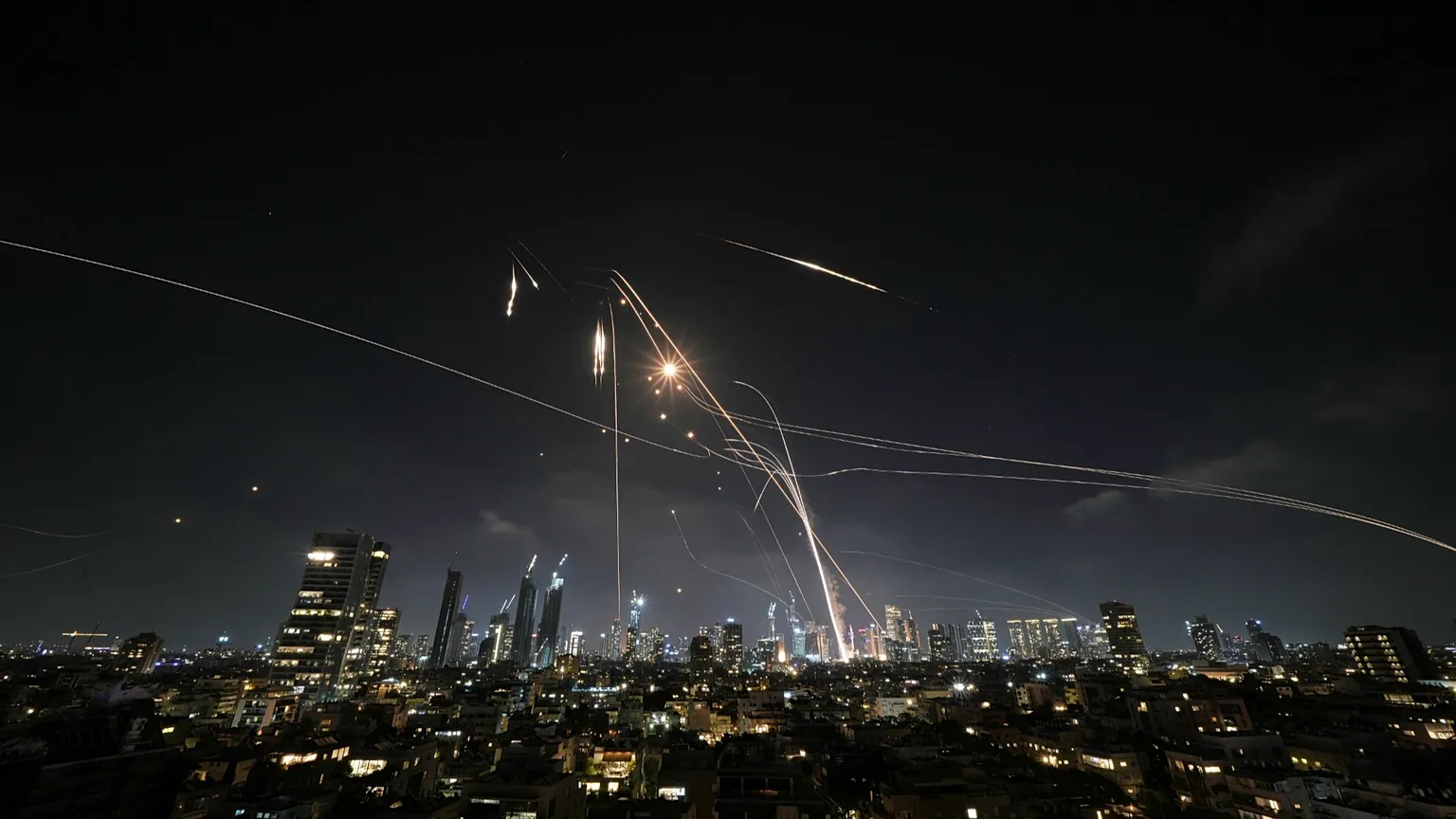 Illustrative image: Israel’s Iron Dome launches missiles over Tel Aviv on 13 June 2025, attempting to intercept incoming rockets.